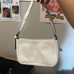 white hand bag